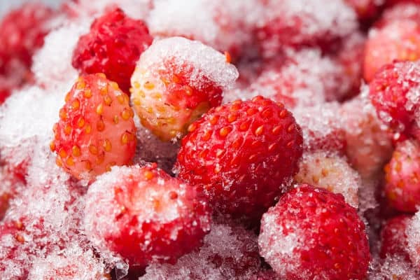 frozen strawberries with frost on them