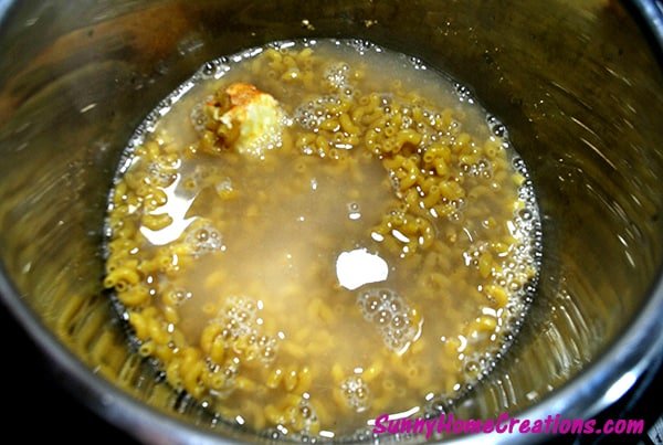 Jalapeno popper mac & cheese ingredients stirred in the instant pot