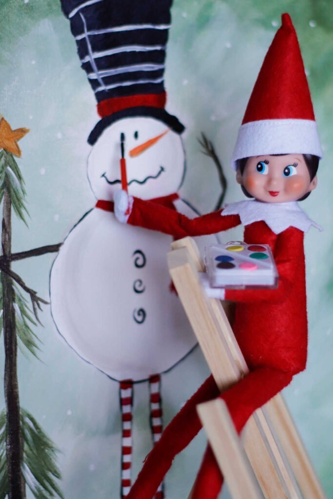 female elf paining snowman.