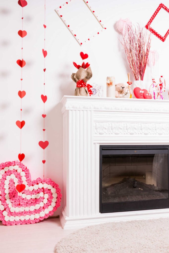 Fireplace with Valentine decorations around and on the mantle.